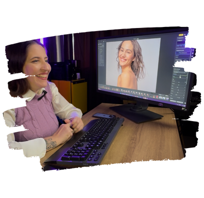 Smiling photographer editing portrait in evoto ai photo editing software